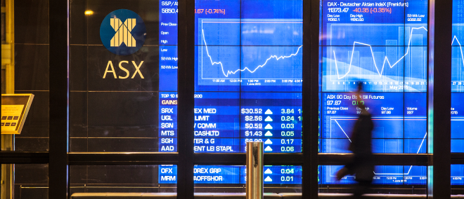 ASX trading screens displaying stock prices and market data in Australia.