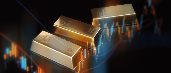Gold bars placed against a financial market chart with price lines and candlestick patterns, symbolising gold prices, safe-haven assets, and commodity market trends.