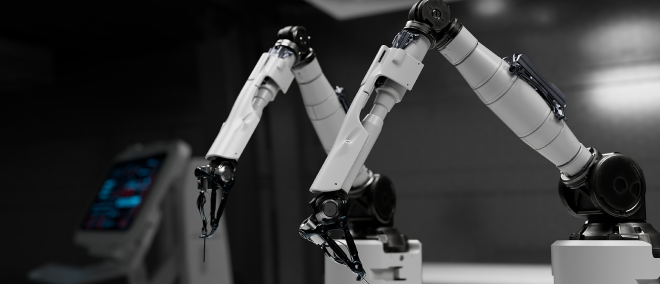 Close-up of industrial robotic arms operating in a high-tech manufacturing environment, illustrating automation, robotics, and AI-driven industrial processes.